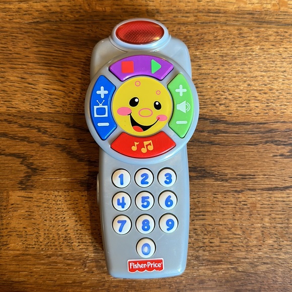 Multi-pack take along toys. Includes remote, phone and misc. book type toy. - Picture 10 of 11